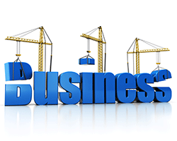 Image of the word business being built with cranes